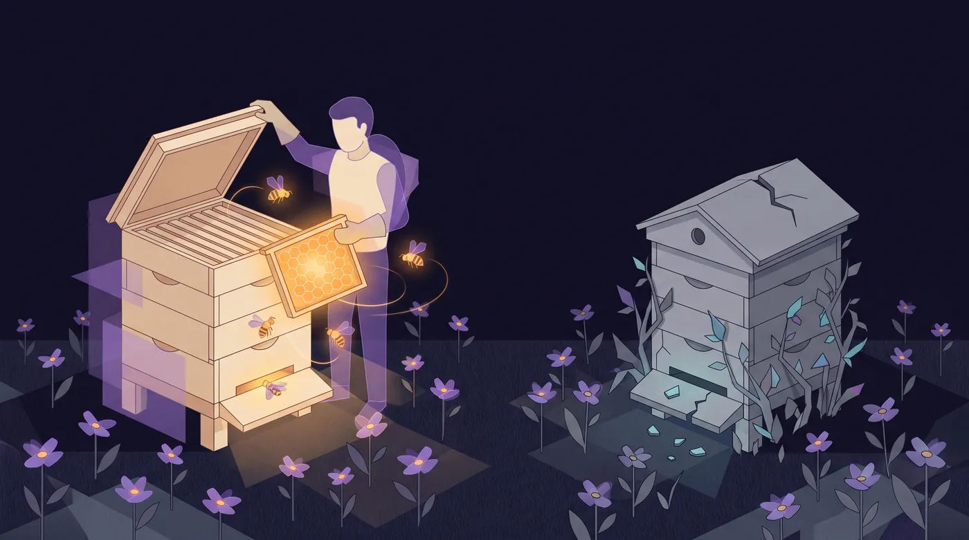 Two beehives in the same flowering meadow. A keeper lifts a frame of glowing honeycomb from the tended hive on the left. The grey hive on the right is cracked, overgrown with weeds and empty.